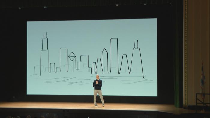 Apple CEO Tim Cook appears before a crowd inside Chicago's Lane Tech High School.
