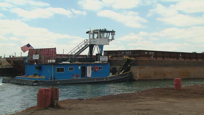 The tugboat Kimberly Selvick pushing a barge on the Calumet River. 
