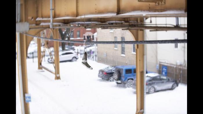 Hanging shoes on a wire under the snowy Paulina Brown Line (Submitted by Cody Corrall)