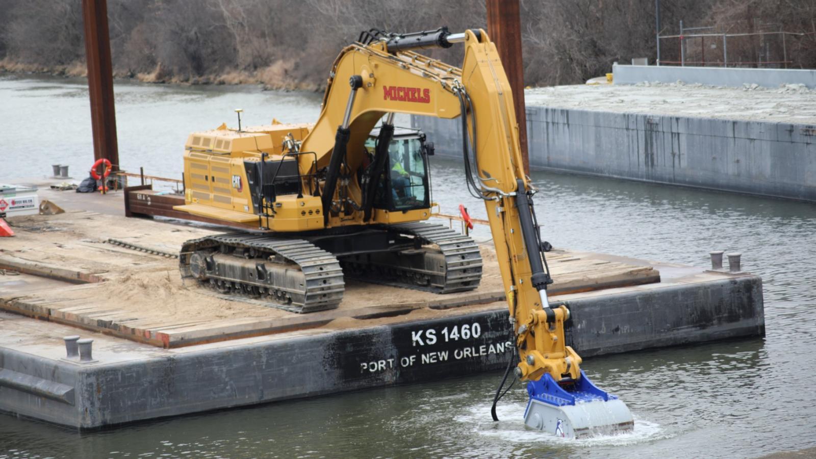 Contractors used an underwater jackhammer called an “Xcentric Ripper” to break up and remove bedrock from within the river channel below the Brandon Road Lock to make way for the engineered channel for the Brandon Road Interbasin Project. (U.S. Army Corps of Engineers)