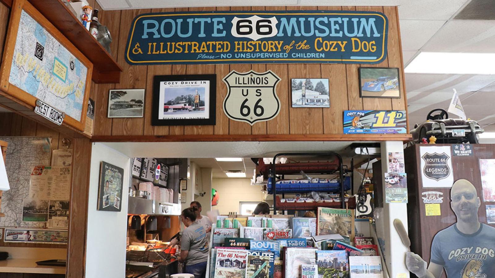 A mini Route 66 museum decorated with photos, maps and magazines about the route overlooked the kitchen where staff prepare food for customers. (Chloe Park / Medill Illinois News Bureau)