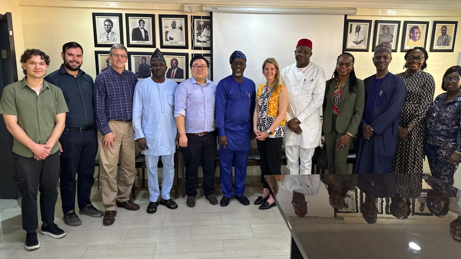 Northwestern University professor John Rogers, pictured here with his team in Nigeria, estimates that so far about 10,000 devices have been deployed that have been used to monitor some 30,000 infants in about 20 countries around the world. (Courtesy of John Rogers)