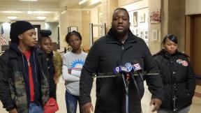 Martinez Sutton, center, speaks at City Hall on Thursday, Nov. 14, 2019 about the killing of his sister Rekia Boyd by former Chicago police Detective Dante Servin in 2012. (Matt Masterson / WTTW News) Martinez Sutton, center, speaks at City Hall on Thursday, Nov. 14, 2019 about the killing of his sister Rekia Boyd by former Chicago police Detective Dante Servin in 2012. (Matt Masterson / WTTW News)