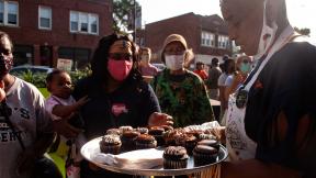 Brown Sugar Bakery employees hand out free cupcakes as part of the 75th Street Boardwalk grand opening on Saturday, Sept. 5, 2020. (Grace Del Vecchio / WTTW News) Brown Sugar Bakery employees hand out free cupcakes as part of the 75th Street Boardwalk grand opening on Saturday, Sept. 5, 2020. (Grace Del Vecchio / WTTW News)