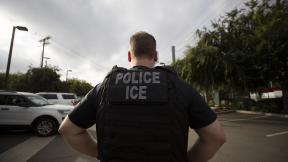 In this July 8, 2019, file photo, a U.S. Immigration and Customs Enforcement officer looks on during an operation in Escondido, California. (AP Photo / Gregory Bull, File) In this July 8, 2019, file photo, a U.S. Immigration and Customs Enforcement officer looks on during an operation in Escondido, California. (AP Photo / Gregory Bull, File)
