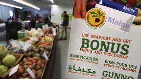 In this Friday, March 17, 2017, file photo, a sign advertises a program that allows food stamp recipients to use their EBT cards to shop at a farmer’s market in Topsham, Maine. (AP Photo / Robert F. Bukaty, File) In this Friday, March 17, 2017, file photo, a sign advertises a program that allows food stamp recipients to use their EBT cards to shop at a farmer’s market in Topsham, Maine. (AP Photo / Robert F. Bukaty, File)