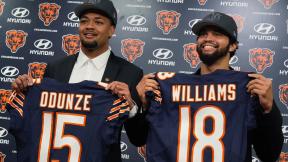 Chicago Bears No. 9 draft pick wide receiver Rome Odunze, left, and No. 1 draft pick quarterback Caleb Williams, right, hold up jerseys as they pose for a photo during an NFL football news conference in Lake Forest, Ill., Friday, April 26, 2024. (AP Photo/Nam Y. Huh)