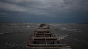 Waves kick up under a dark sky along the shore of Batabano, Cuba, Monday, Sept. 26, 2022. (AP Photo / Ramon Espinosa)