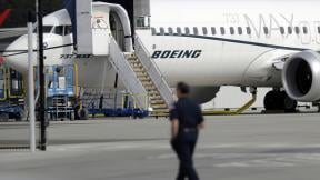 In this March 14, 2019, file photo a worker walks next to a Boeing 737 MAX 8 airplane parked at Boeing Field in Seattle. (AP Photo / Ted S. Warren, File) In this March 14, 2019, file photo a worker walks next to a Boeing 737 MAX 8 airplane parked at Boeing Field in Seattle. (AP Photo / Ted S. Warren, File)