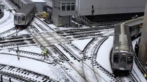 CTA trains move along snow-covered tracks Monday, Jan. 28, 2019, in Chicago. (AP Photo / Kiichiro Sato) CTA trains move along snow-covered tracks Monday, Jan. 28, 2019, in Chicago. (AP Photo / Kiichiro Sato)