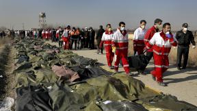 Rescue workers carry the body of a victim of a Ukrainian plane crash in Shahedshahr, southwest of the capital Tehran, Iran, Wednesday, Jan. 8, 2020. (AP Photo / Ebrahim Noroozi) Rescue workers carry the body of a victim of a Ukrainian plane crash in Shahedshahr, southwest of the capital Tehran, Iran, Wednesday, Jan. 8, 2020. (AP Photo / Ebrahim Noroozi)