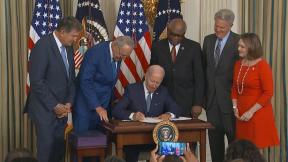 President Joe Biden signs the Inflation Reduction Act into law at the White House on Aug. 16, 2022. (CNN)