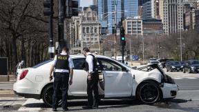 Chicago police investigate in the northbound lanes of Lake Shore Drive at East Monroe Street, where a 2-year-old boy was shot in the head while he was traveling inside a car near Grant Park, Tuesday, April 6, 2021. (Ashlee Rezin Garcia / Chicago Sun-Times via AP) Chicago police investigate in the northbound lanes of Lake Shore Drive at East Monroe Street, where a 2-year-old boy was shot in the head while he was traveling inside a car near Grant Park, Tuesday, April 6, 2021. (Ashlee Rezin Garcia / Chicago Sun-Times via AP)