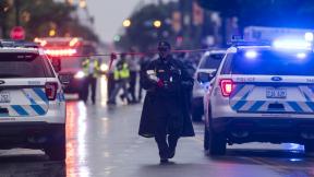Chicago police investigate the scene of a mass shooting where more then a dozen people were shot in the Auburn Gresham neighborhood of Chicago, Tuesday, July 21, 2020. (Tyler LaRiviere / Chicago Sun-Times via AP) Chicago police investigate the scene of a mass shooting where more then a dozen people were shot in the Auburn Gresham neighborhood of Chicago, Tuesday, July 21, 2020. (Tyler LaRiviere / Chicago Sun-Times via AP)