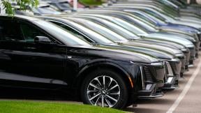 Vehicles sit in a row outside a dealership, June 2, 2024, in Lone Tree, Colo. Car dealerships across North America have faced a major disruption this week. (AP Photo / David Zalubowski, File)