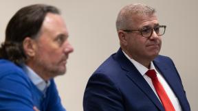 Darren Bailey, right, offers testimony during a hearing over allegations that he illegally coordinated campaign expenditures with GOP operative Dan Proft, left, during the 2022 gubernatorial campaign. (Andrew Adams / Capitol News Illinois)