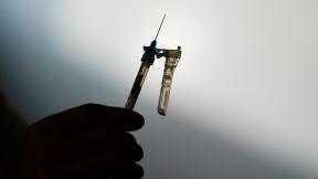 FILE - A syringe is prepared at a clinic in Norristown, Pa., Dec. 7, 2021. (Matt Rourke / AP Photo, File)