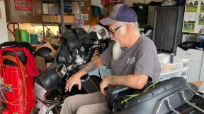 Steve Gray, a 61-year-old moderate Republican “though never a Trump fan,” sits on one of his Harley Davidson motorcycles inside his garage in Rio, Wis., on Sept. 12, 2022. Gray said he is frustrated with the June U.S. Supreme Court decision overturning Roe v. Wade. (AP Photo / Thomas Beaumont)