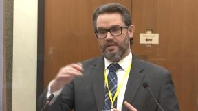 In this image from video, defense attorney Eric Nelson questions Dr. Andrew Baker, Hennepin County Chief Medical Examiner, as Hennepin County Judge Peter Cahill presides Friday, April 9, 2021, in the trial of former Minneapolis police Officer Derek Chauvin at the Hennepin County Courthouse in Minneapolis, Minn. (Court TV via AP, Pool) In this image from video, defense attorney Eric Nelson questions Dr. Andrew Baker, Hennepin County Chief Medical Examiner, as Hennepin County Judge Peter Cahill presides Friday, April 9, 2021, in the trial of former Minneapolis police Officer Derek Chauvin at the Hennepin County Courthouse in Minneapolis, Minn. (Court TV via AP, Pool)