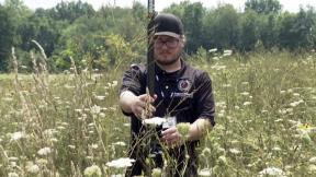 In this image taken from video, Matthew Bussler, Tribal Historic Preservation Officer at Pokagon Band of Potawatomi Indians, uses mapping equipment in Dowagiac, Mich., on Aug. 10, 2023. (AP Photo/Melissa Winder)