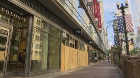 Boarded-up storefronts in the Loop on Monday, June 1, 2020 show damage caused by looting over the weekend. (WTTW News) Boarded-up storefronts in the Loop on Monday, June 1, 2020 show damage caused by looting over the weekend. (WTTW News)