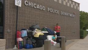 Migrants outside a Chicago police station. (WTTW News) Migrants outside a Chicago police station. (WTTW News)