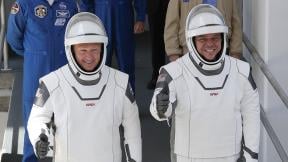 In this May, 30, 2020 file photo, NASA astronauts Douglas Hurley, left, and Robert Behnken walk out of the Neil A. Armstrong Operations and Checkout Building on their way to Pad 39-A, at the Kennedy Space Center in Cape Canaveral, Fla. (AP Photo / John Raoux, File) In this May, 30, 2020 file photo, NASA astronauts Douglas Hurley, left, and Robert Behnken walk out of the Neil A. Armstrong Operations and Checkout Building on their way to Pad 39-A, at the Kennedy Space Center in Cape Canaveral, Fla. (AP Photo / John Raoux, File)