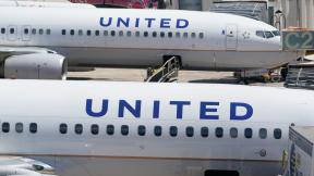 FILE - Two United Airlines Boeing 737s are parked at the gate at the Fort Lauderdale-Hollywood International Airport in Fort Lauderdale, Fla., July 7, 2022. (Wilfredo Lee / AP Photo, File)