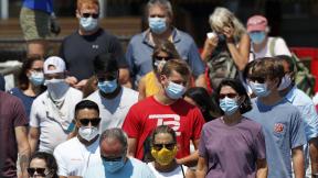 In this July 30, 2020, file photo, passengers board a Casco Bay Lines ferry bound for Peaks Island in Portland, Maine. America's failure so far to contain the spread of the coronavirus as it moves across the country has been met with astonishment and alarm on both sides of the Atlantic. (AP Photo/Robert F. Bukaty, File) In this July 30, 2020, file photo, passengers board a Casco Bay Lines ferry bound for Peaks Island in Portland, Maine. America's failure so far to contain the spread of the coronavirus as it moves across the country has been met with astonishment and alarm on both sides of the Atlantic. (AP Photo/Robert F. Bukaty, File)