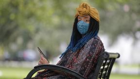 Jasmin Pierre poses for a photo with her smartphone app, in New Orleans, Thursday, July 2, 2020. (AP Photo / Gerald Herbert) Jasmin Pierre poses for a photo with her smartphone app, in New Orleans, Thursday, July 2, 2020. (AP Photo / Gerald Herbert)