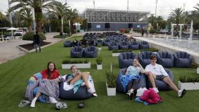 In this Thursday, June 18, 2020 file photo, people sit outdoors to watch a movie as part of a program offered by the Miami Dolphins at Hard Rock Stadium during the coronavirus pandemic in Miami Gardens, Fla. (AP Photo / Lynne Sladky) In this Thursday, June 18, 2020 file photo, people sit outdoors to watch a movie as part of a program offered by the Miami Dolphins at Hard Rock Stadium during the coronavirus pandemic in Miami Gardens, Fla. (AP Photo / Lynne Sladky)