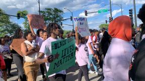 A coalition of people, led by young organizers, marched down Martin Luther King Jr. Drive in Bronzeville on June 6, 2024, to bring attention to missing and murdered Black girls and women. (Eunice Alpasan / WTTW News)