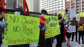 James Norwood, 53, of the suburb of South Holland, came to the Saturday, May 30, 2020 protest with his daughter Hannah. (Evan Garcia / WTTW News) James Norwood, 53, of the suburb of South Holland, came to the Saturday, May 30, 2020 protest with his daughter Hannah. (Evan Garcia / WTTW News)